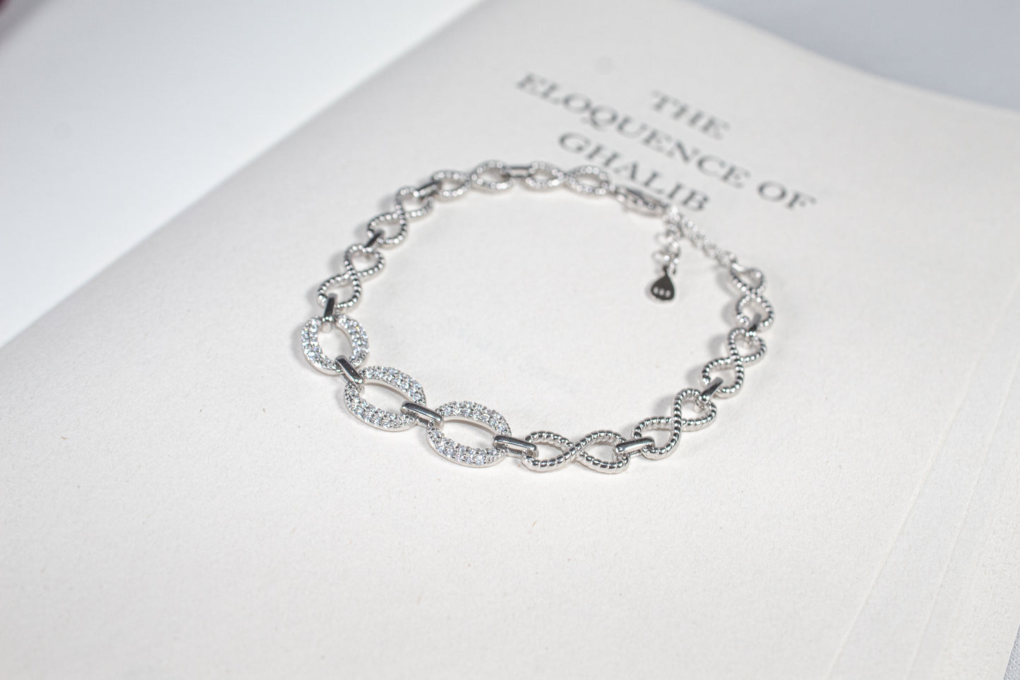Infinity Loop Crystal Charm